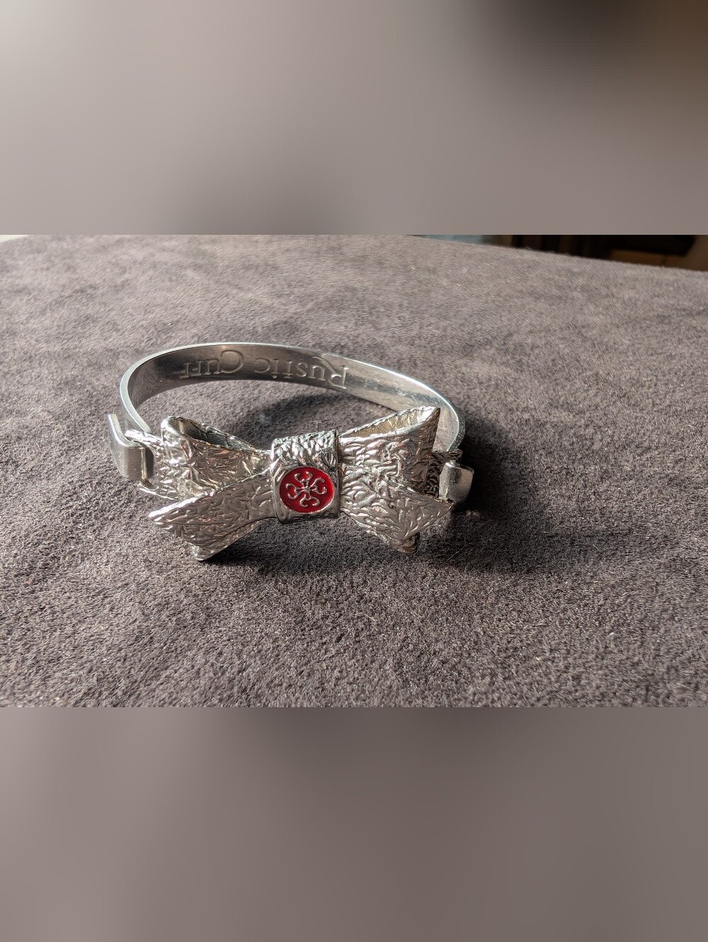 Rustic Cuff Silver Bow Bracelet with Red Accent